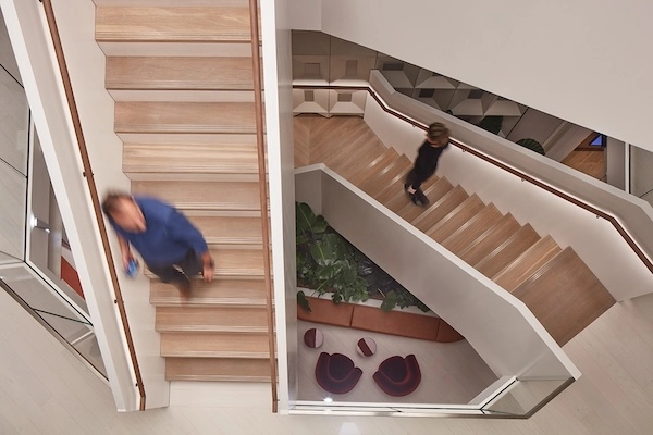 People walking up and down the stairs at Myo St Paul's.