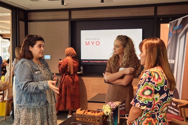A discussion between employees at a team-building event.