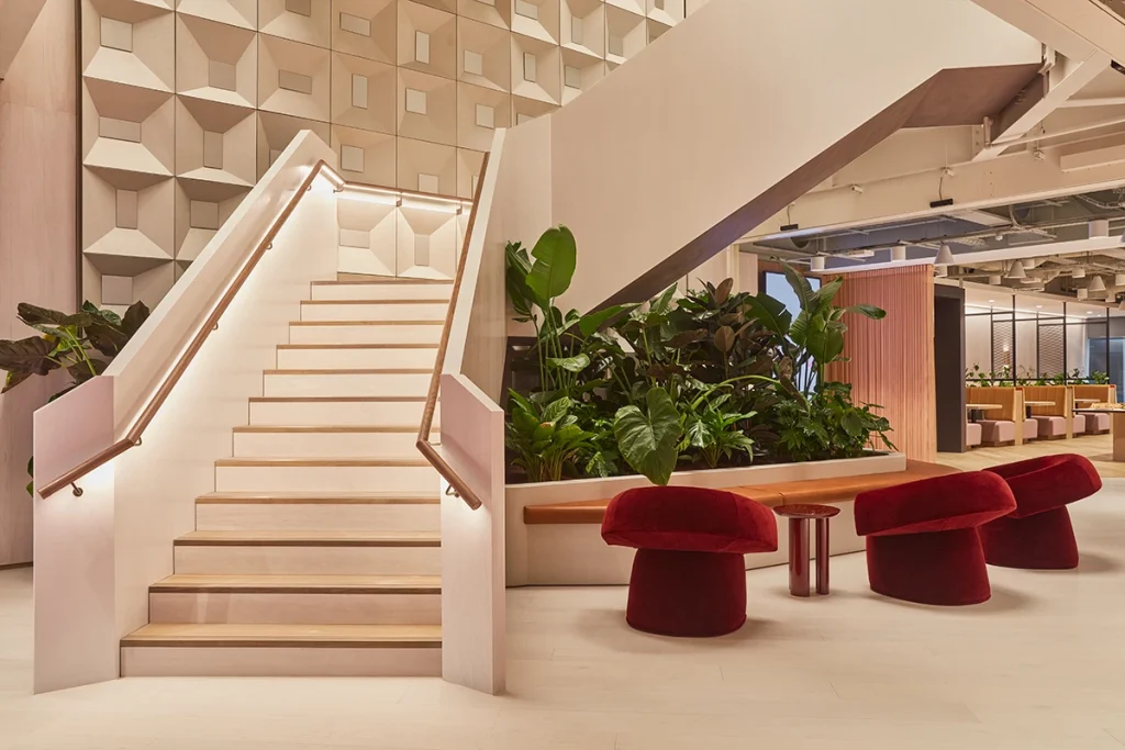 Biophilic design and soft furnishings near a staircase at Myo St Pauls.
