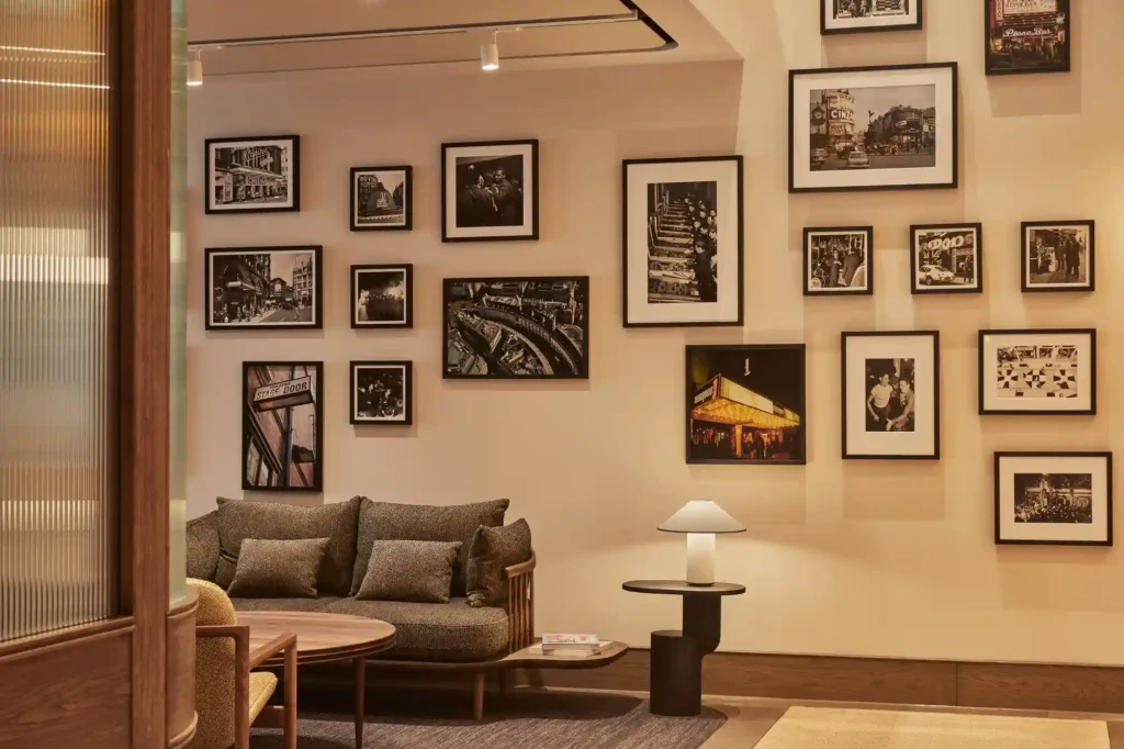 A wall in MYO Piccadilly with historic photos of the area.